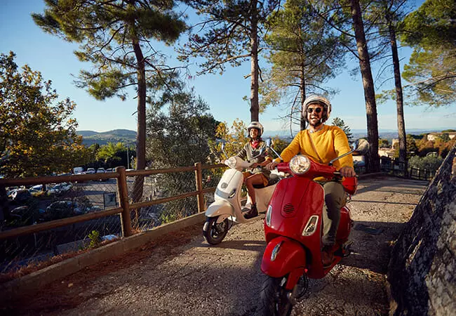 happy couple on scooters after getting motorbike finance approved