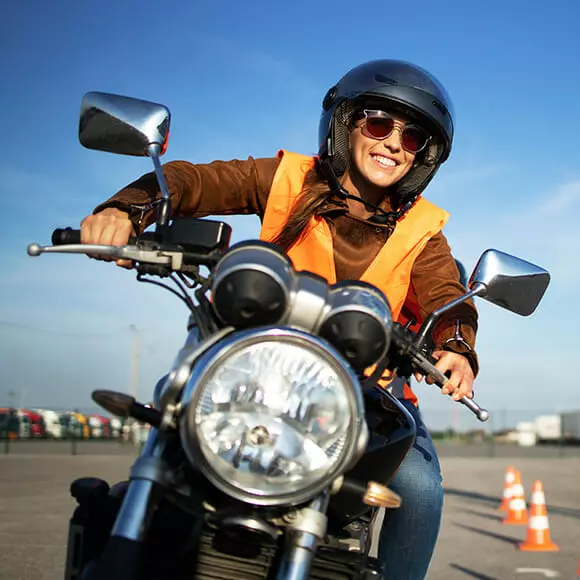 woman on motorbike depicting a positive motorbike loan experience
